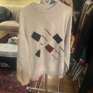 Tan vintage sweater with geometric pattern on the front